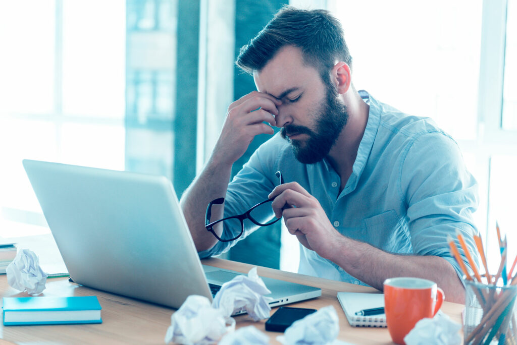 Business owner looking tired of having to do their own IT